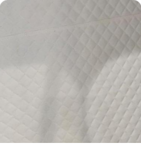 Cream quilted leather interior lining swatch